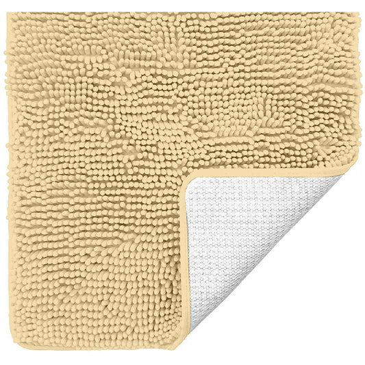 Neat Valley yellow tufted bath mat with one corner lifted to show the backing